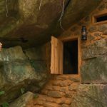 I built myself a shelter of rocks, wood and mud under a large rock